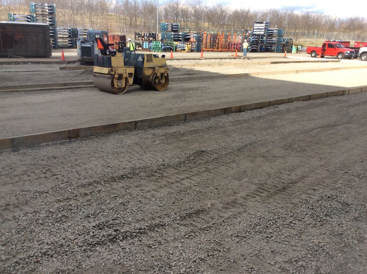 Large-scale concrete paving for industrial warehouse expansion.