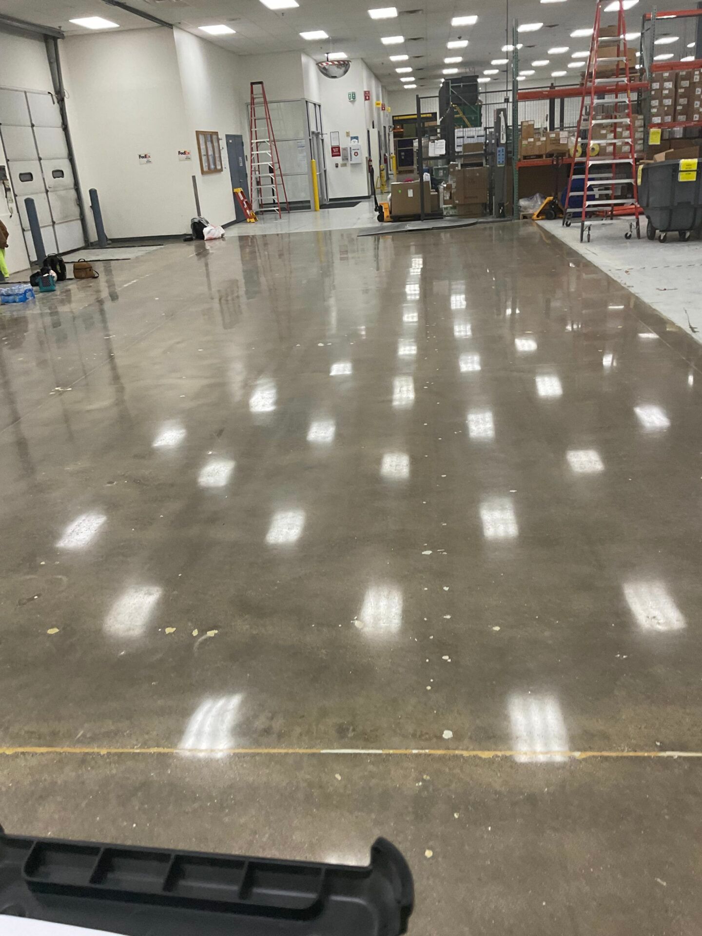 High-sheen polished concrete floor in a medical device facility.