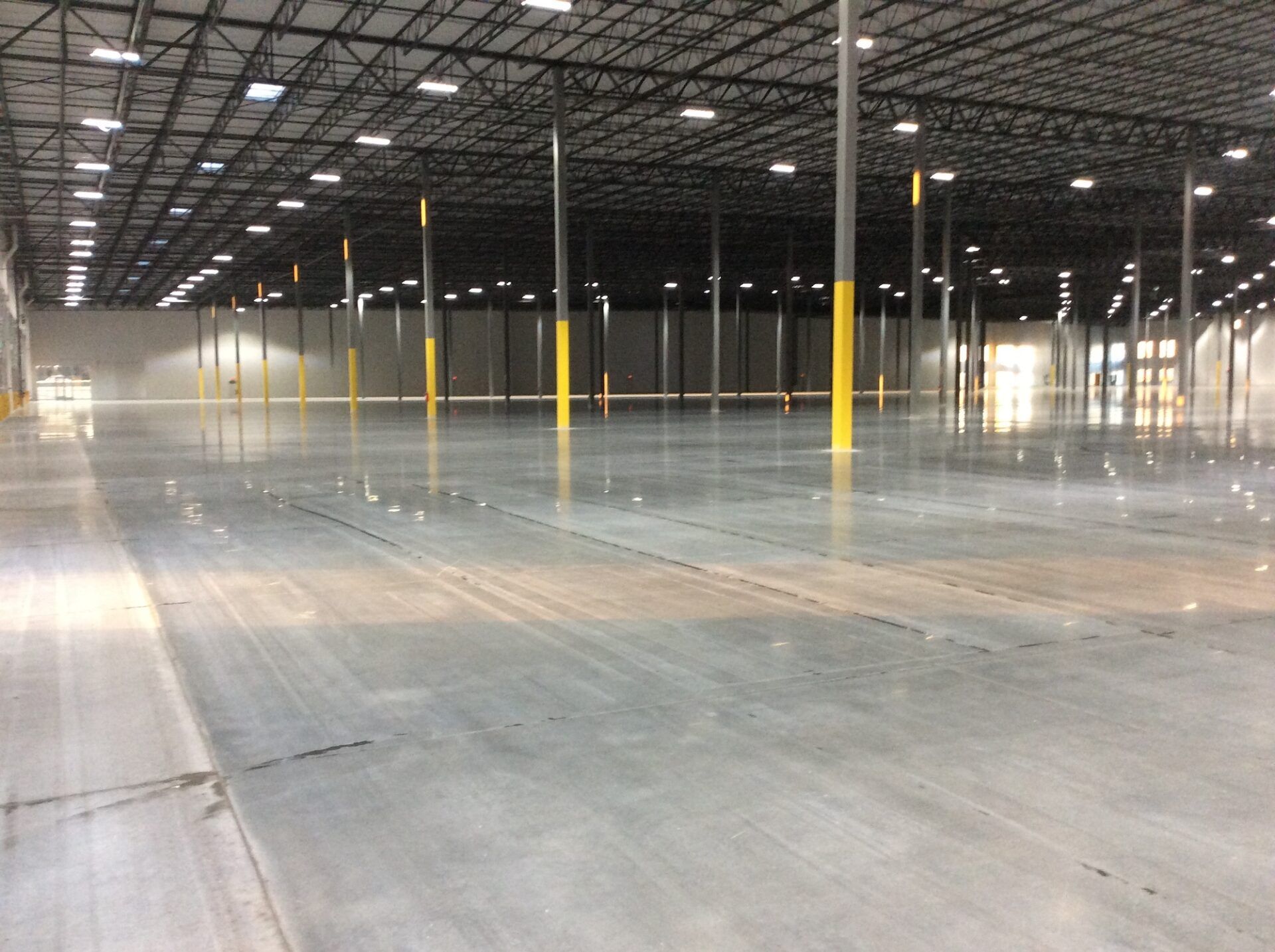 Large polished concrete warehouse floor.
