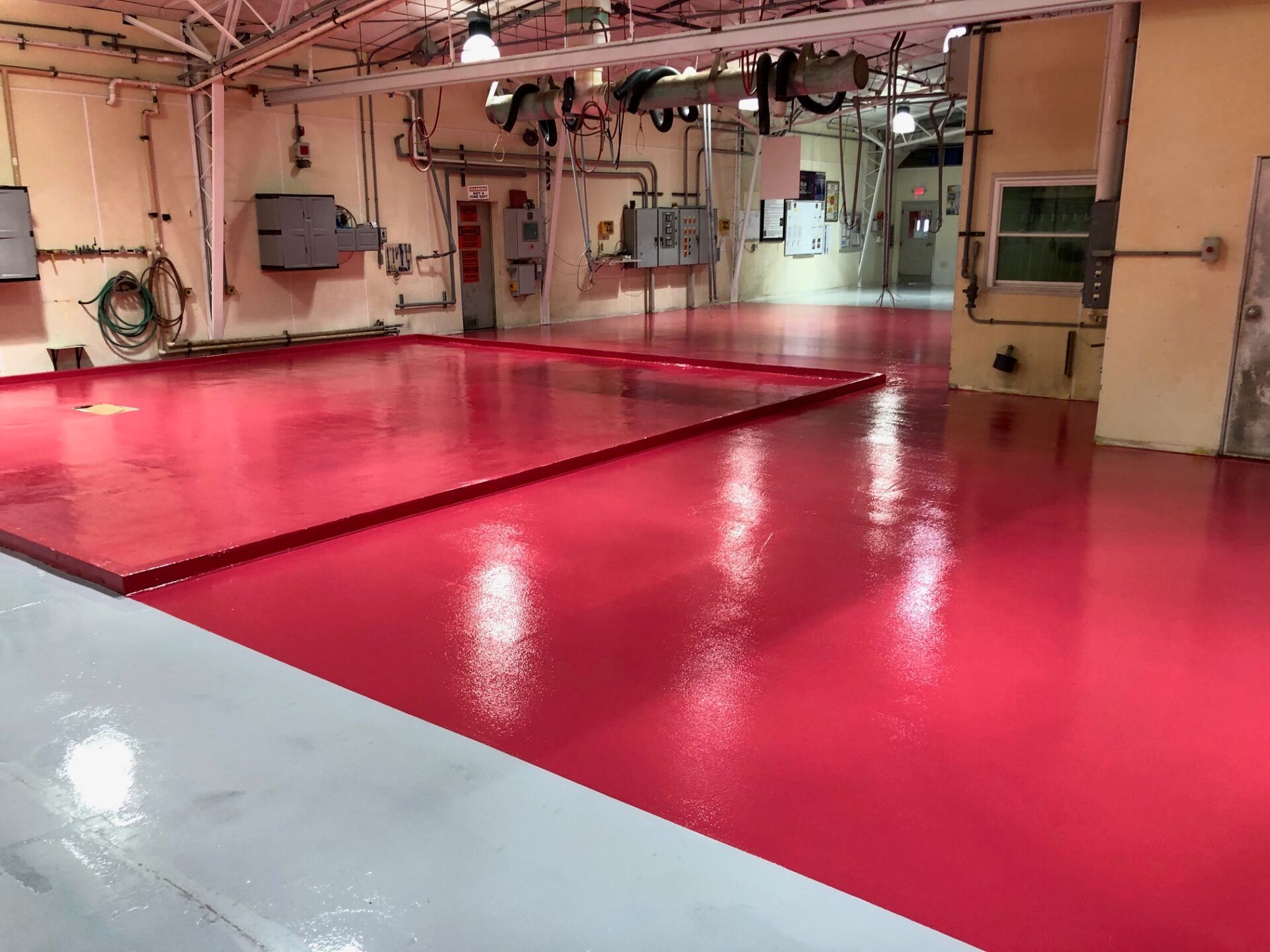 Commercial manufacturing facility with chemical-resistant epoxy flooring