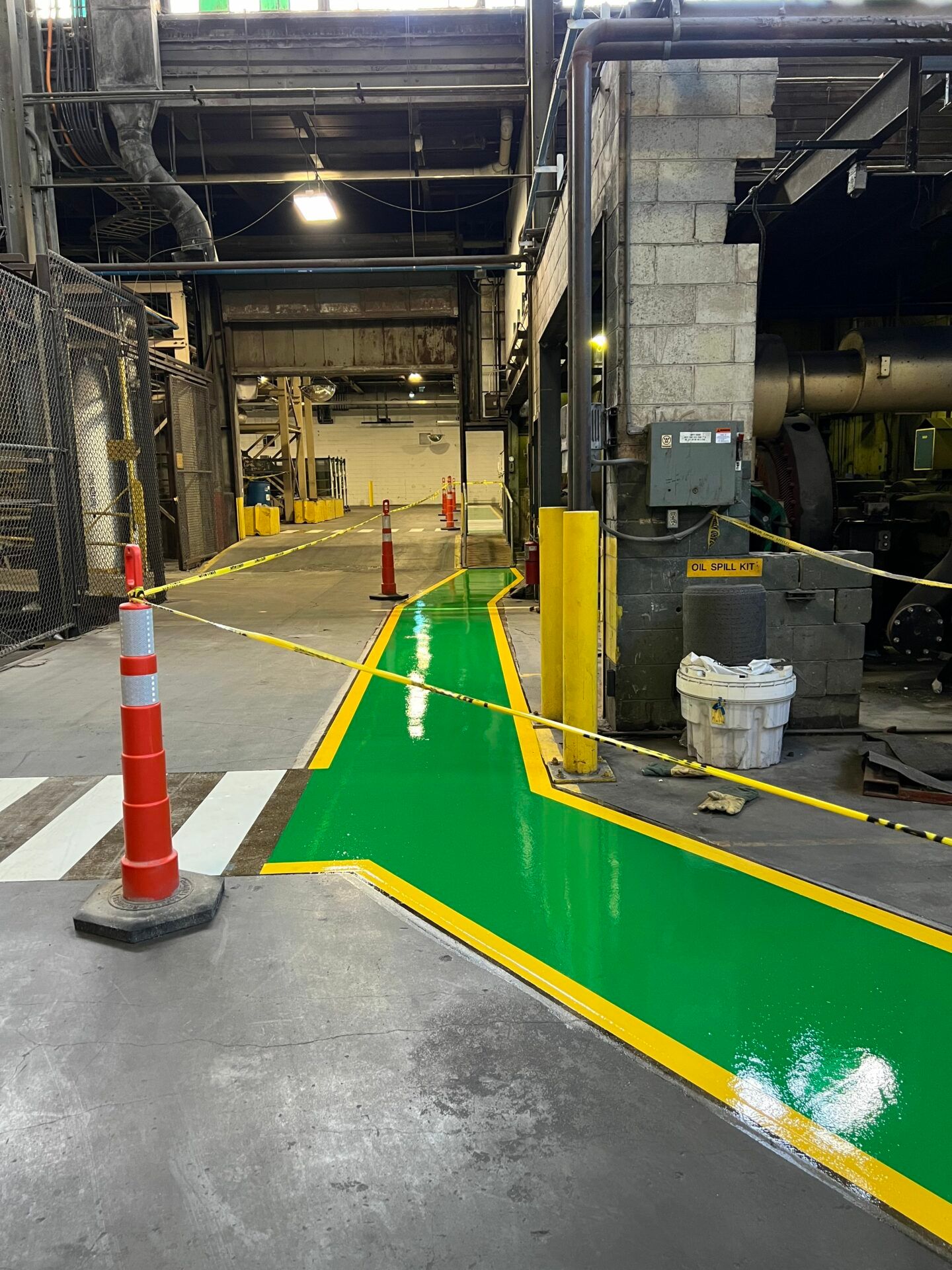 Safety walkway redesign with clear line striping at a global glass manufacturer facility.